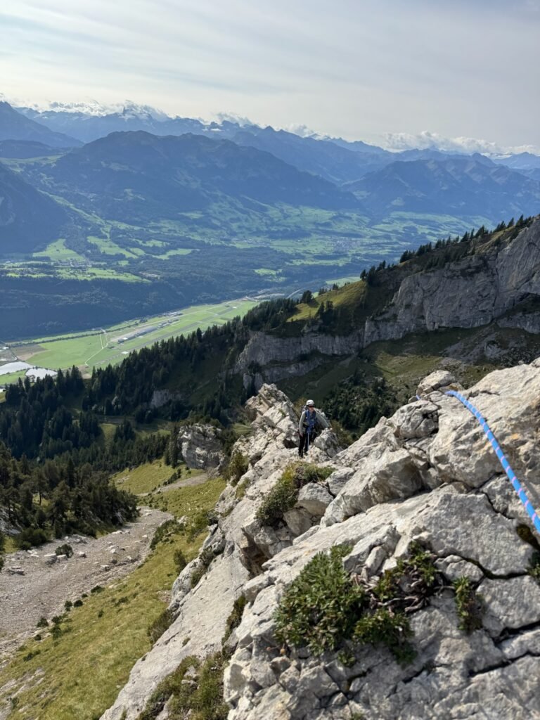 A climber on a ridge.