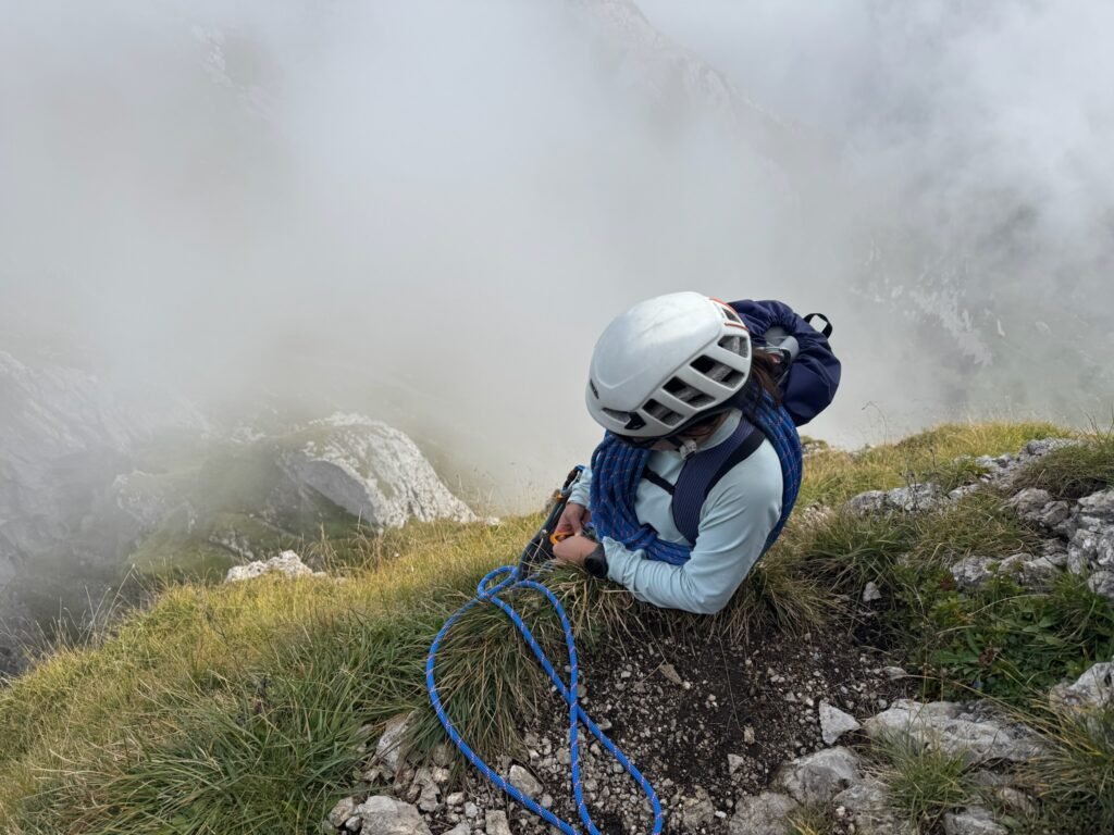 A climber at the edge of a cliff.